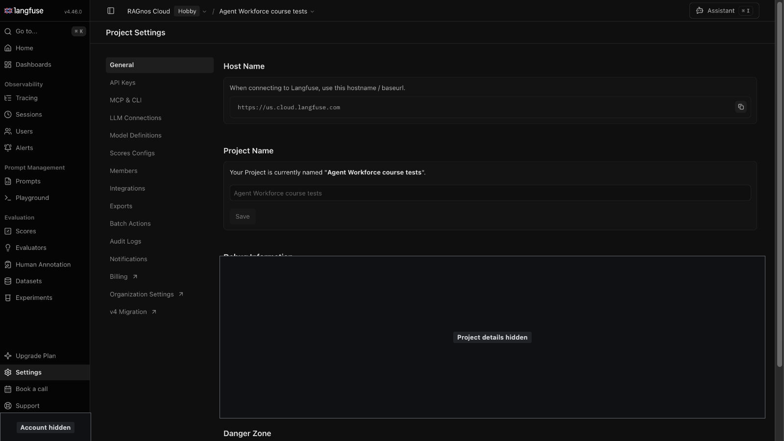 Langfuse Project Settings, General tab, for the course test project. The Host Name panel shows https://us.cloud.langfuse.com, the service address for the US region. Project details below it are masked.